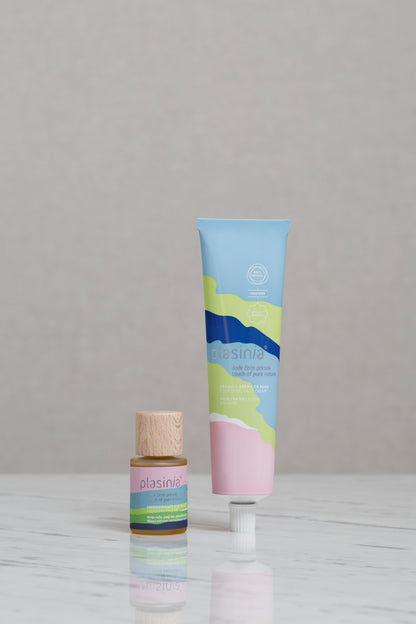 Two cosmetic products with colorful packaging on a gray background